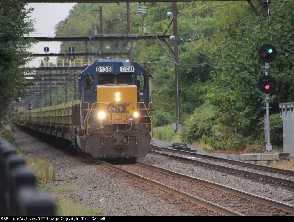 CSX 8138 leading rail train W029 passing SEPTA's CP-IRON